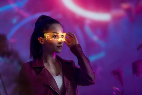 Digital – Woman wearing hi tech AI glasses in futuristic setting