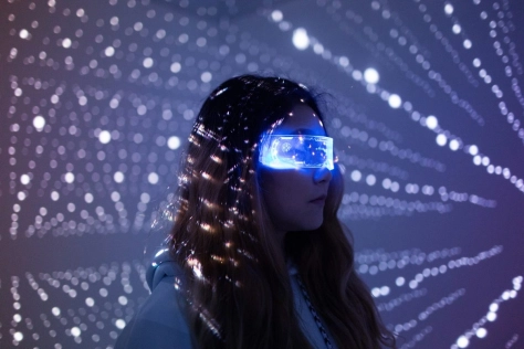 High tech - digital lights woman in light tunnel
