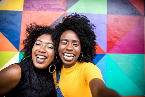People - Women smiling and taking a picture together 