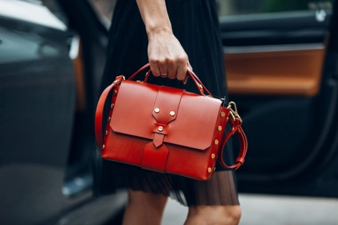 Retail - Woman holding red purse 
