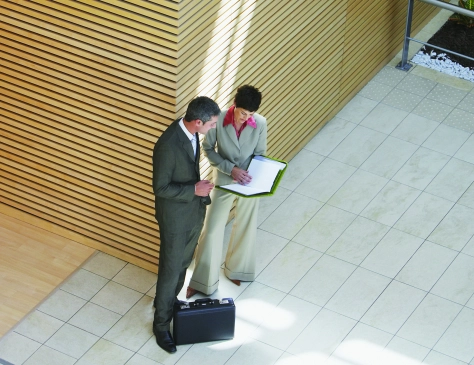 Business-Businesspeople-discussing-with-briefcase-74181081.jpg