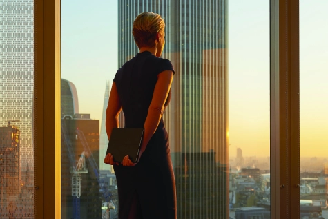 Business-Businesswoman-looking-out-at-cityscape-614500403-1-.jpg