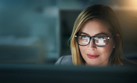 Business-Women-with-glasses-looking-at-her-computer-1067060310.jpg