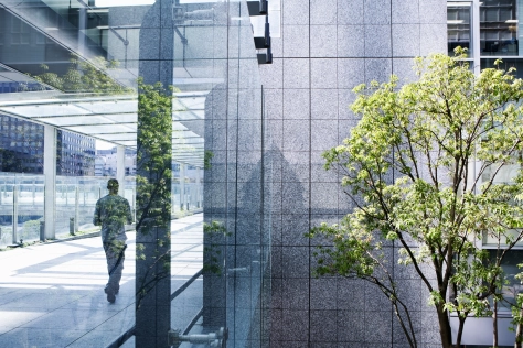 People-man walking in glass building 