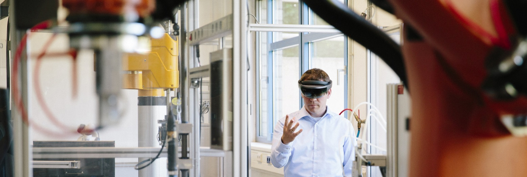 Digital - Man in manufacturing site with AI headset - thin 1040px