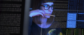 Digital - woman looking at monitor - dark - 1200x500