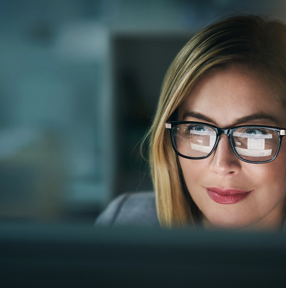 Business-Women-with-glasses-looking-at-her-computer-1067060310.jpg