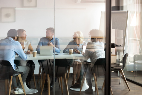Five people in a meeting